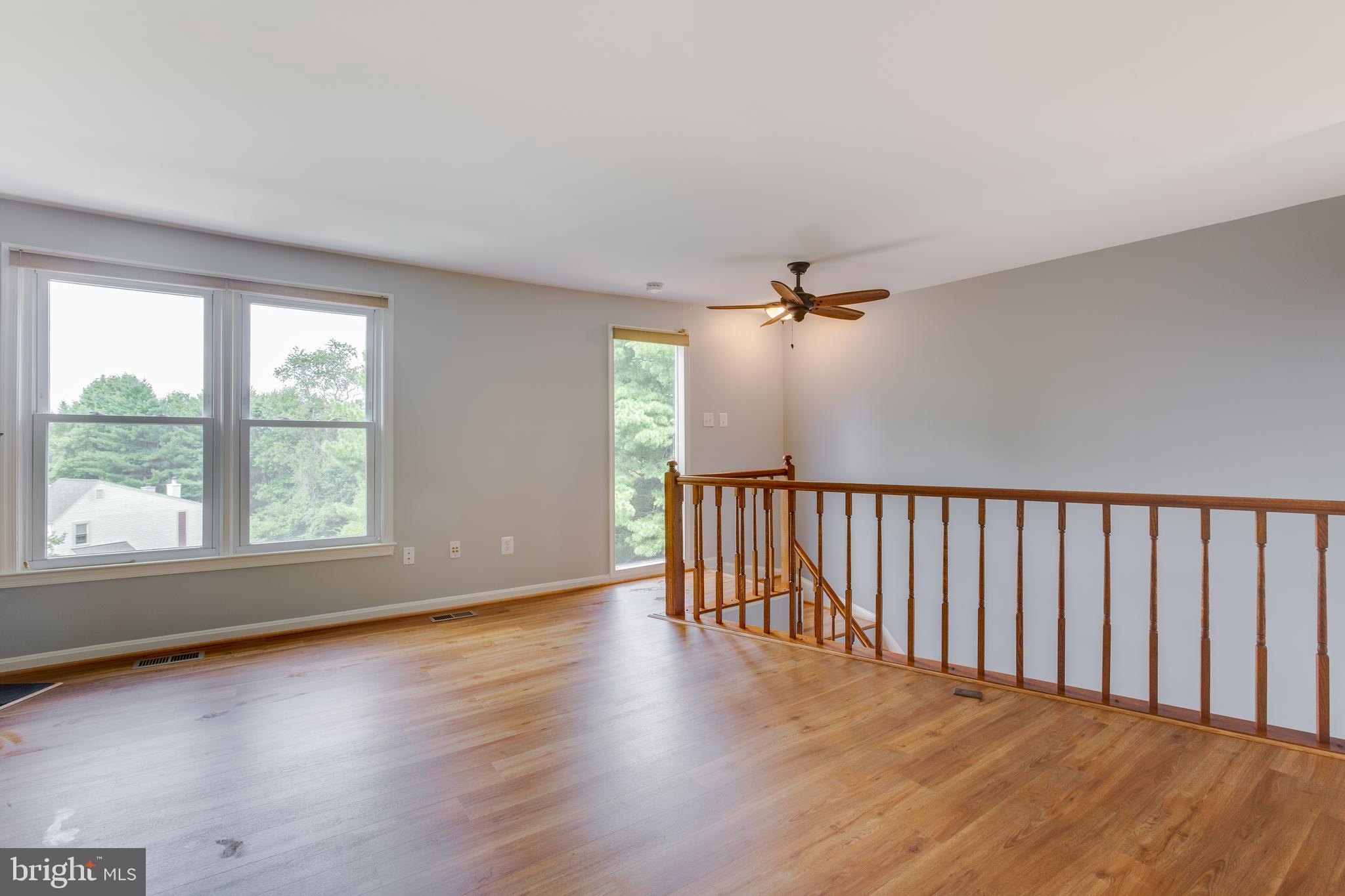 1709 Whisperhill Drive Reston, VA 20194 - Photo 19 of 41 Warm tones compliment flooring, rails and new fan.