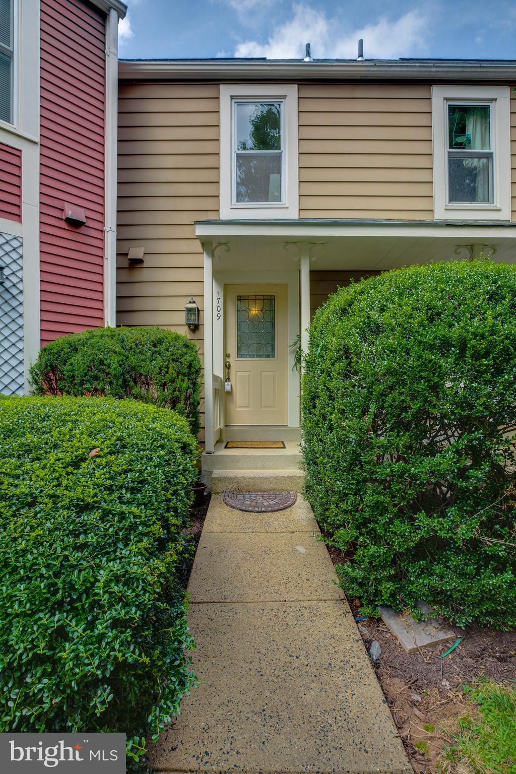 1709 Whisperhill Drive Reston, VA 20194 - Photo 3 of 41 Manicured gardens welcoming you home soon.
