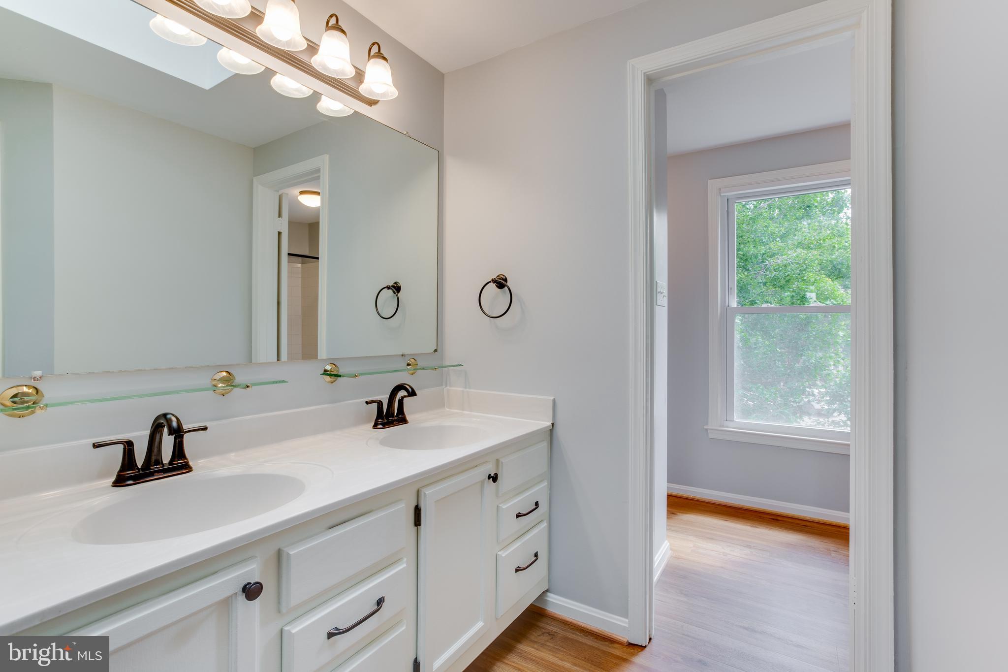 1709 Whisperhill Drive Reston, VA 20194 - Photo 22 of 41 Double sinks and ample cabinets with private bath.