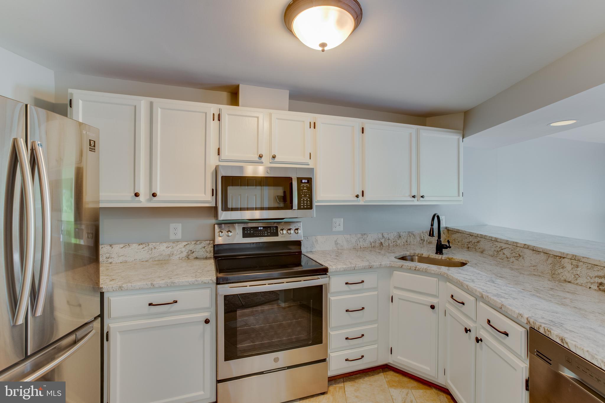 1709 Whisperhill Drive Reston, VA 20194 - Photo 5 of 41 Matching stainless steel appliances & sink.