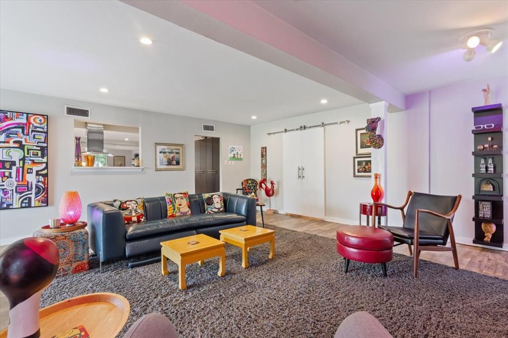 1617 Rambler Drive Waco, TX 76710 - Photo 11 of 36 Living room featuring a barn door, wood finished floors, and recessed lighting