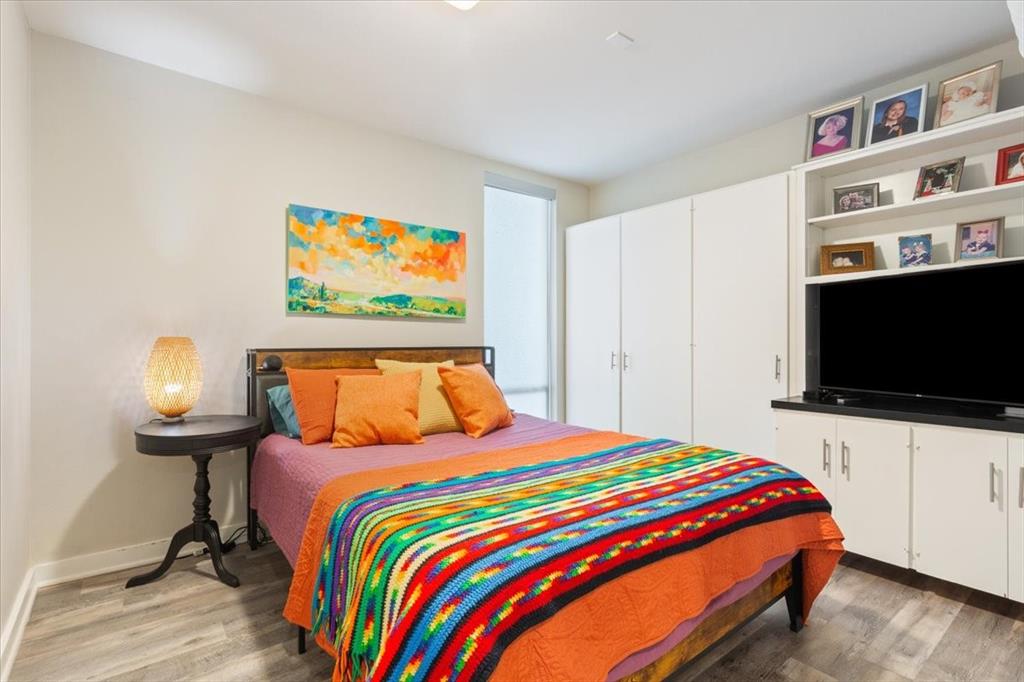1617 Rambler Drive Waco, TX 76710 - Photo 22 of 36 Bedroom featuring light wood finished floors and baseboards