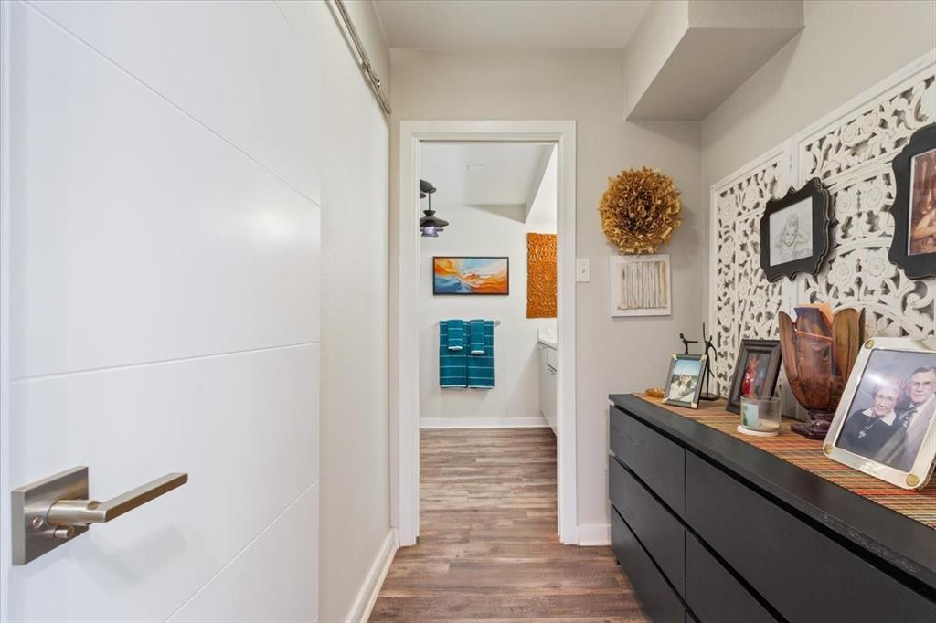 1617 Rambler Drive Waco, TX 76710 - Photo 27 of 36 Hallway with dark wood finished floors and baseboards