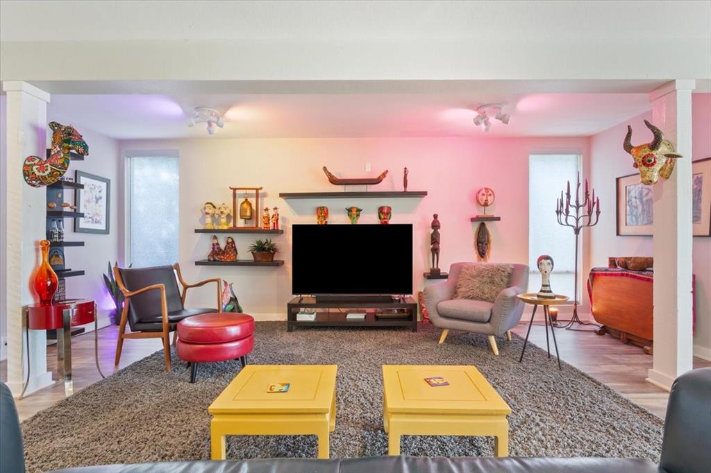 1617 Rambler Drive Waco, TX 76710 - Photo 9 of 36 Living area featuring wood finished floors and baseboards