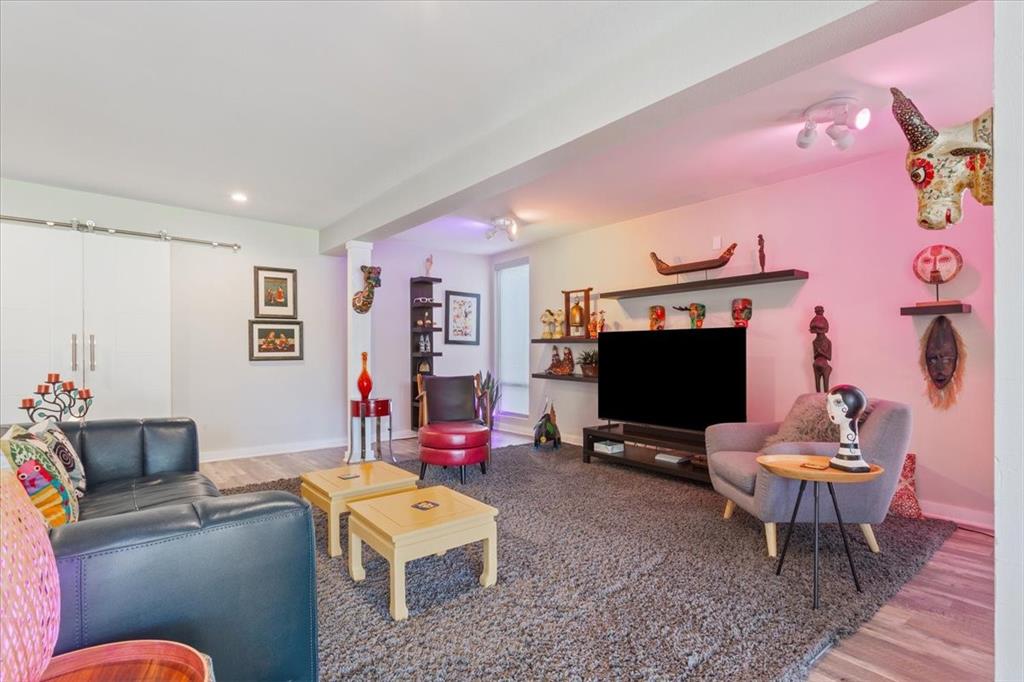 1617 Rambler Drive Waco, TX 76710 - Photo 10 of 36 Living room featuring wood finished floors and baseboards