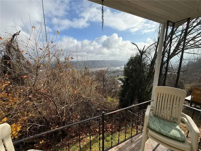 a view of balcony with furniture