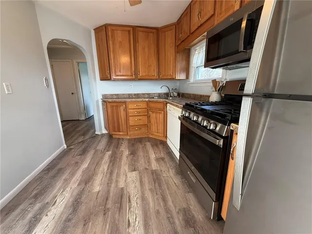 a kitchen with wooden floors and a stove