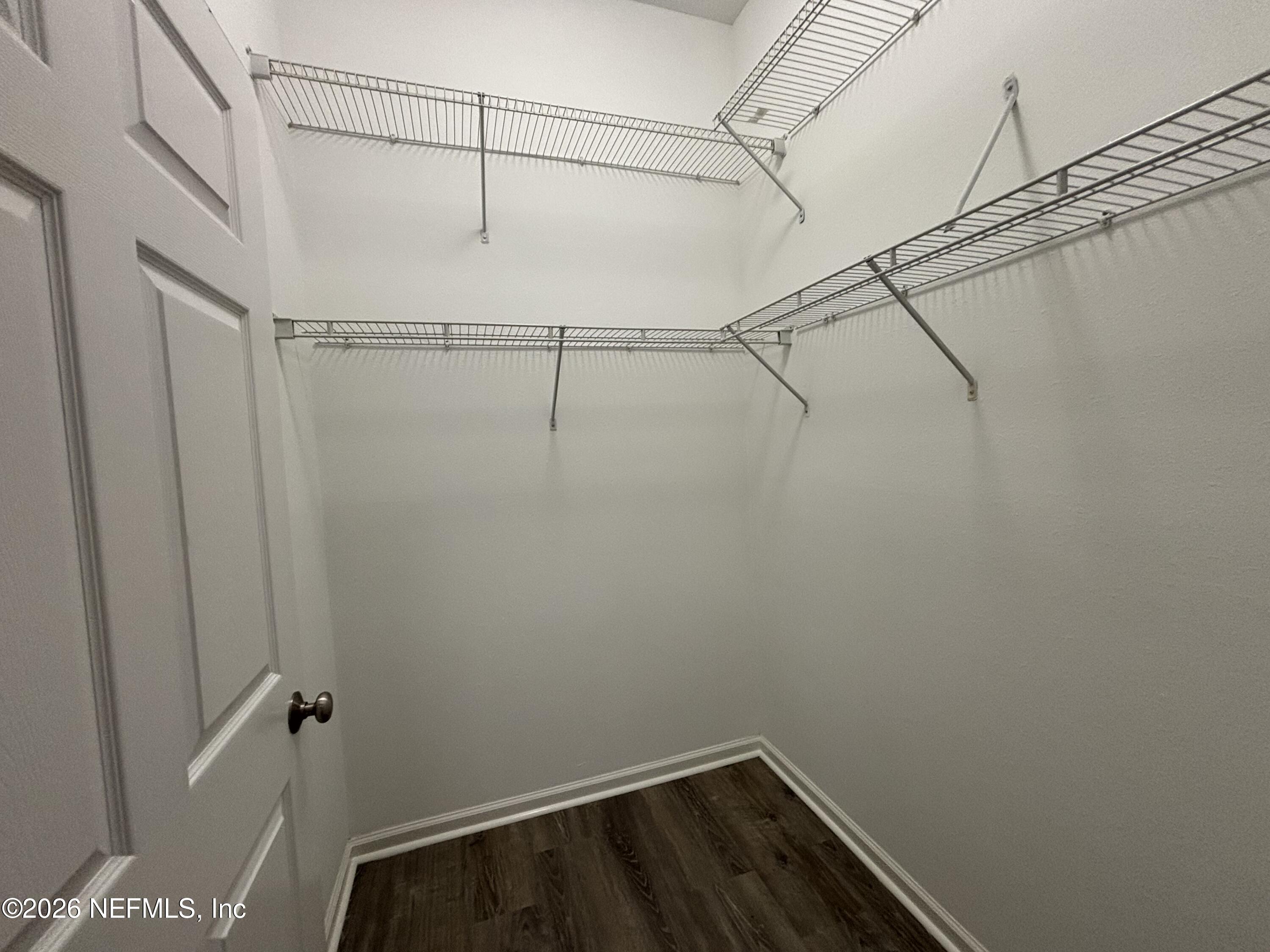 9627 Belda Way, Unit 8 Jacksonville, FL 32257 - Photo 12 of 27 a view of a room with racks on the wall