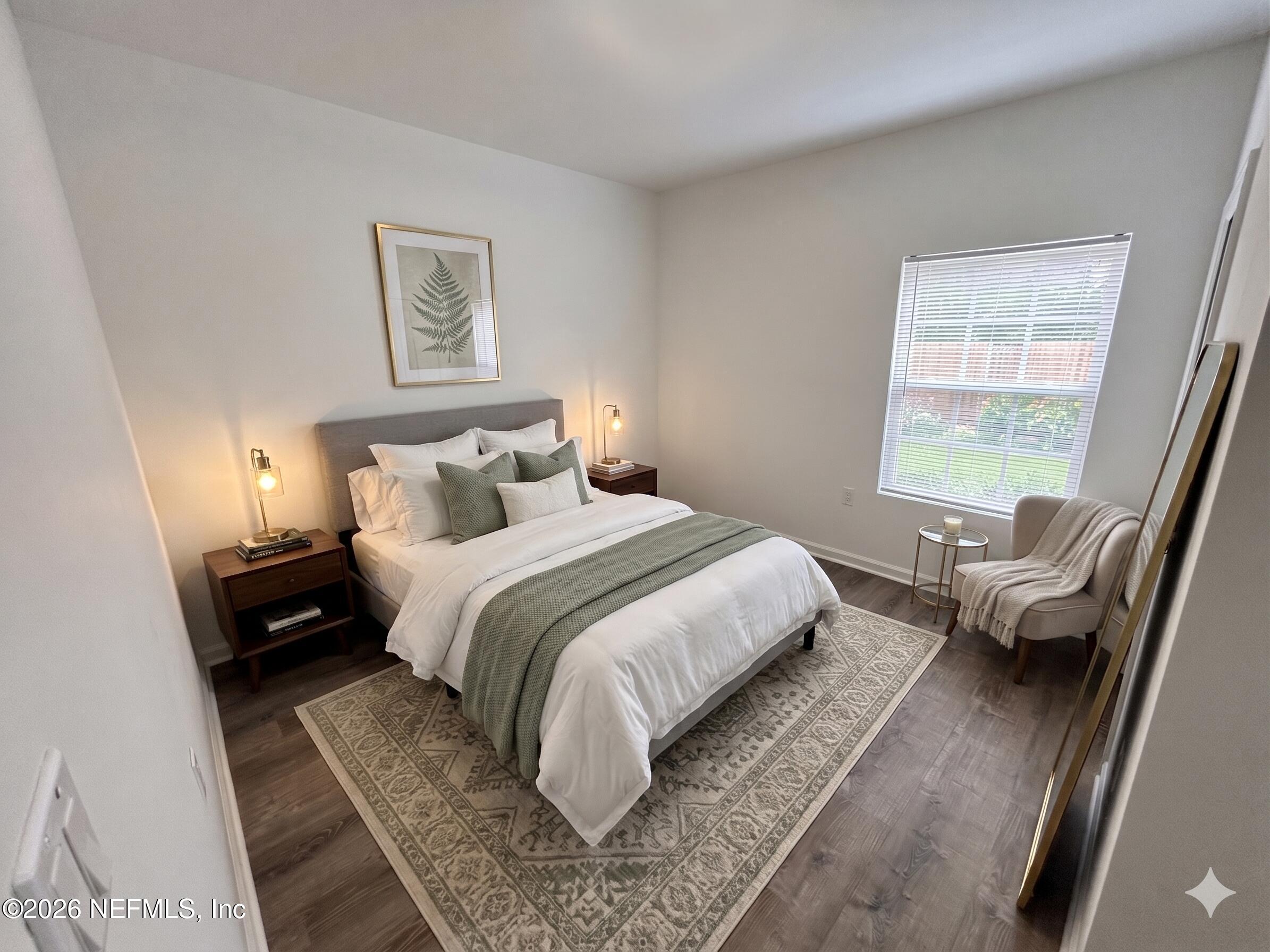 9627 Belda Way, Unit 8 Jacksonville, FL 32257 - Photo 14 of 27 a bedroom with a bed and a couch