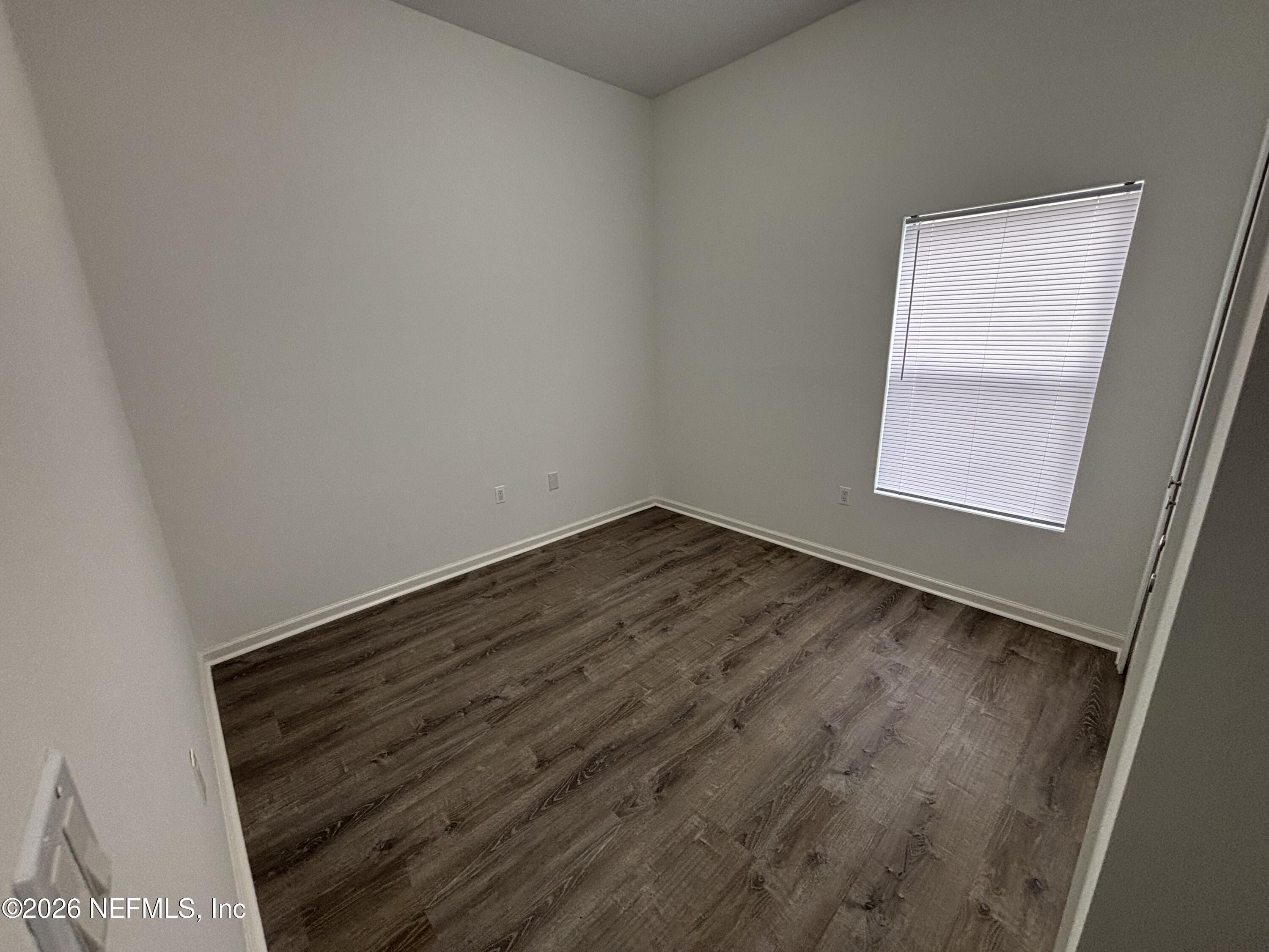 9627 Belda Way, Unit 8 Jacksonville, FL 32257 - Photo 15 of 27 a view of an empty room and wooden floor
