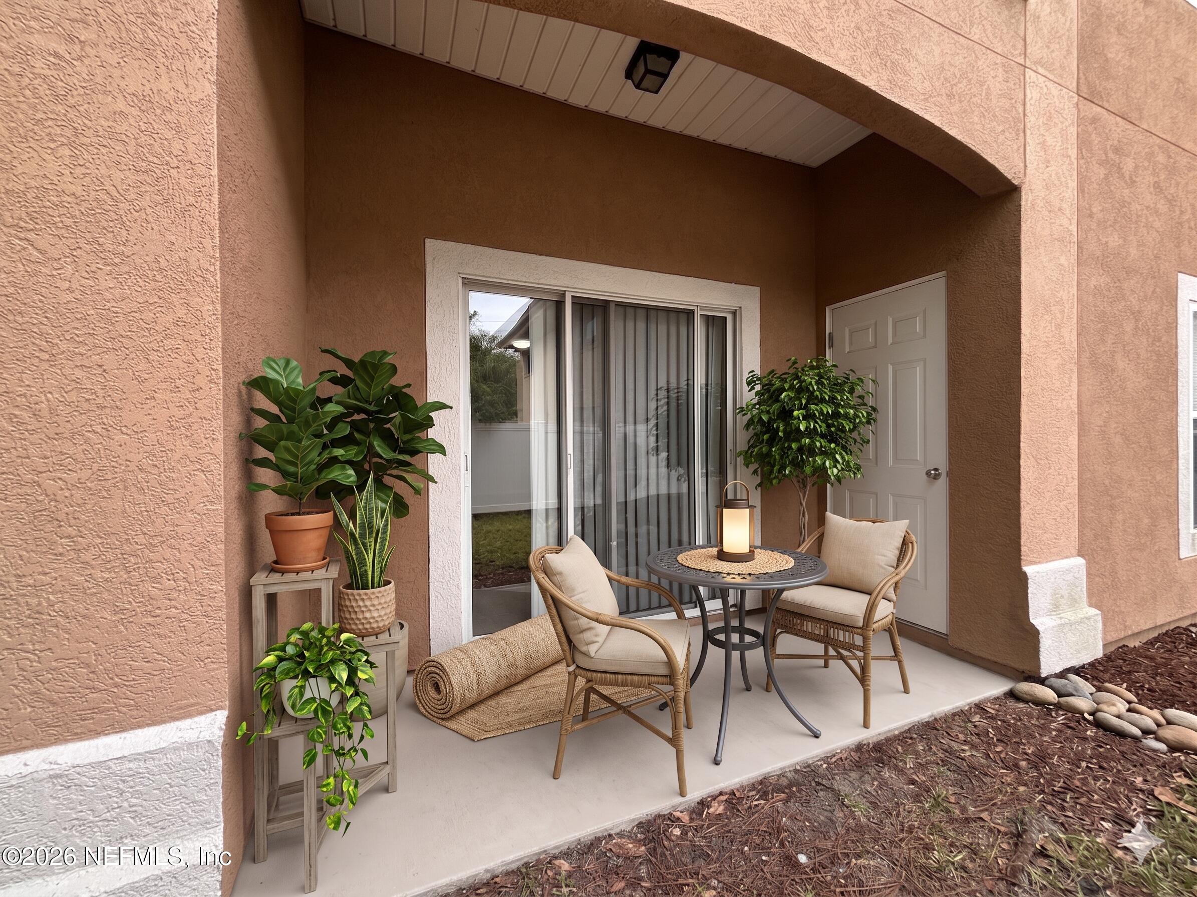 9627 Belda Way, Unit 8 Jacksonville, FL 32257 - Photo 25 of 27 a view of two chairs in a patio