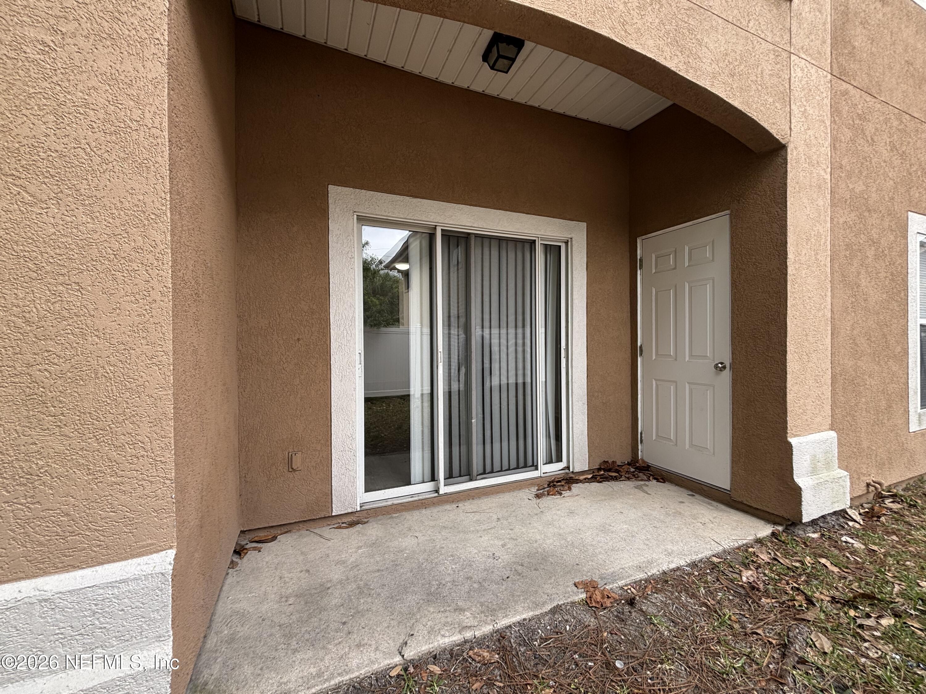 9627 Belda Way, Unit 8 Jacksonville, FL 32257 - Photo 26 of 27 a view of a house with a backyard space