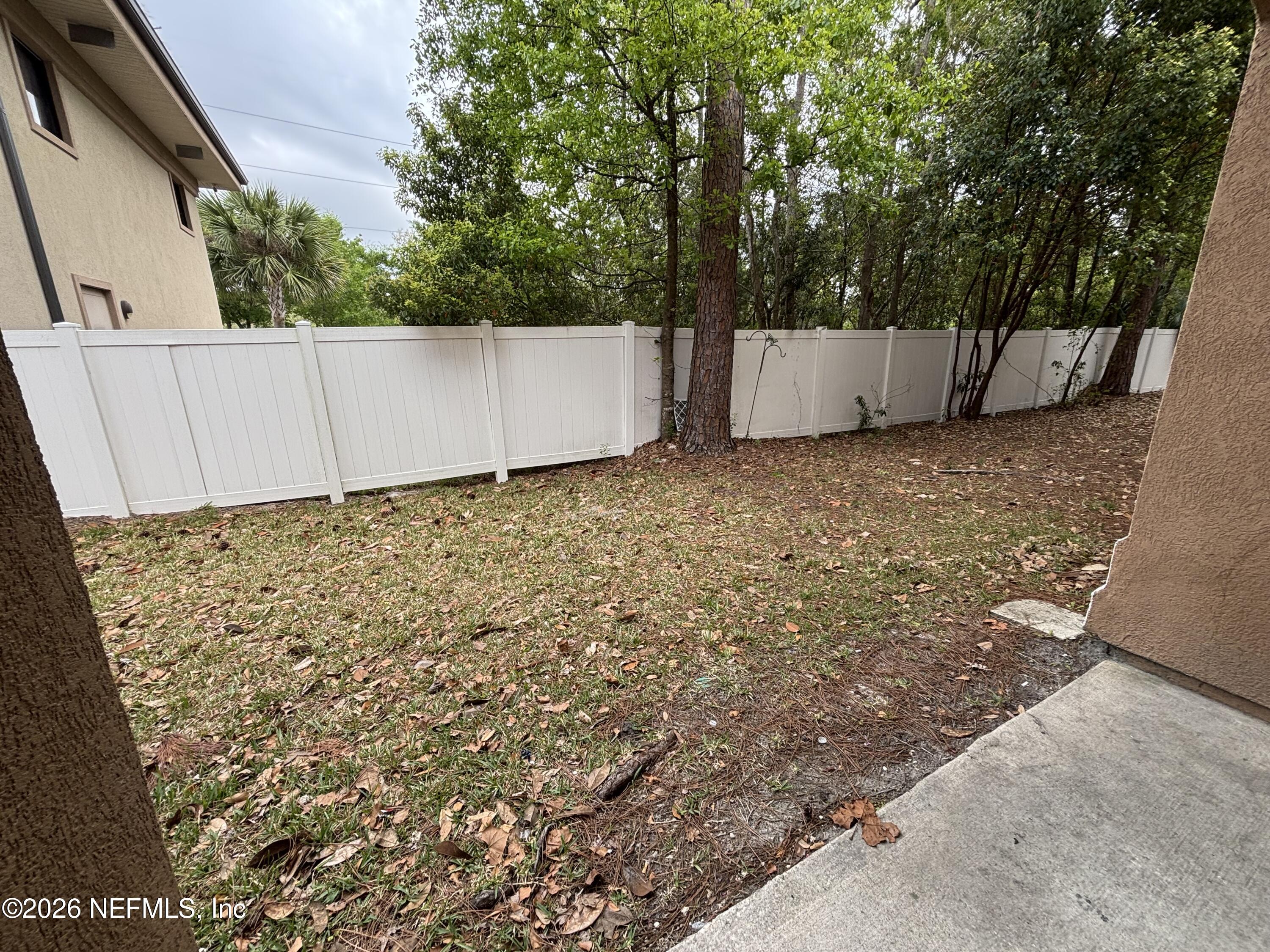 9627 Belda Way, Unit 8 Jacksonville, FL 32257 - Photo 27 of 27 a view of a backyard