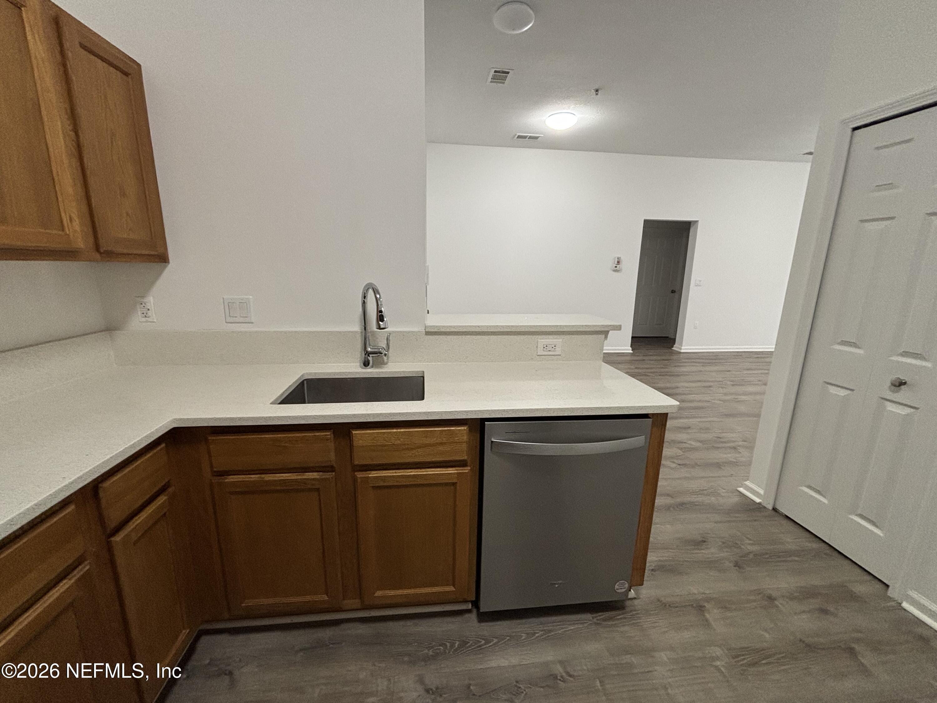9627 Belda Way, Unit 8 Jacksonville, FL 32257 - Photo 3 of 27 a kitchen with a sink and cabinets