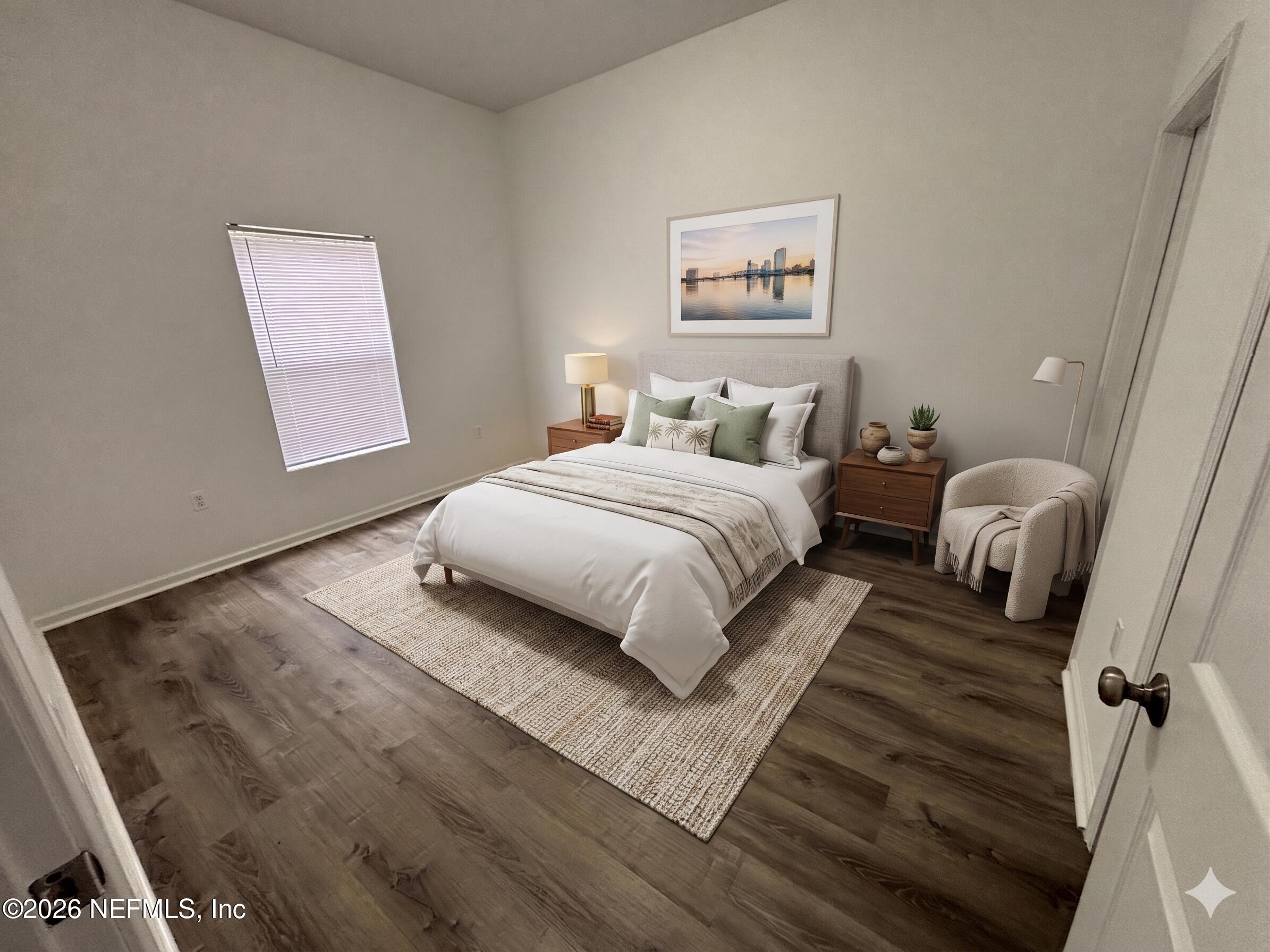 9627 Belda Way, Unit 8 Jacksonville, FL 32257 - Photo 8 of 27 a bedroom with a bed and a large mirror on dresser