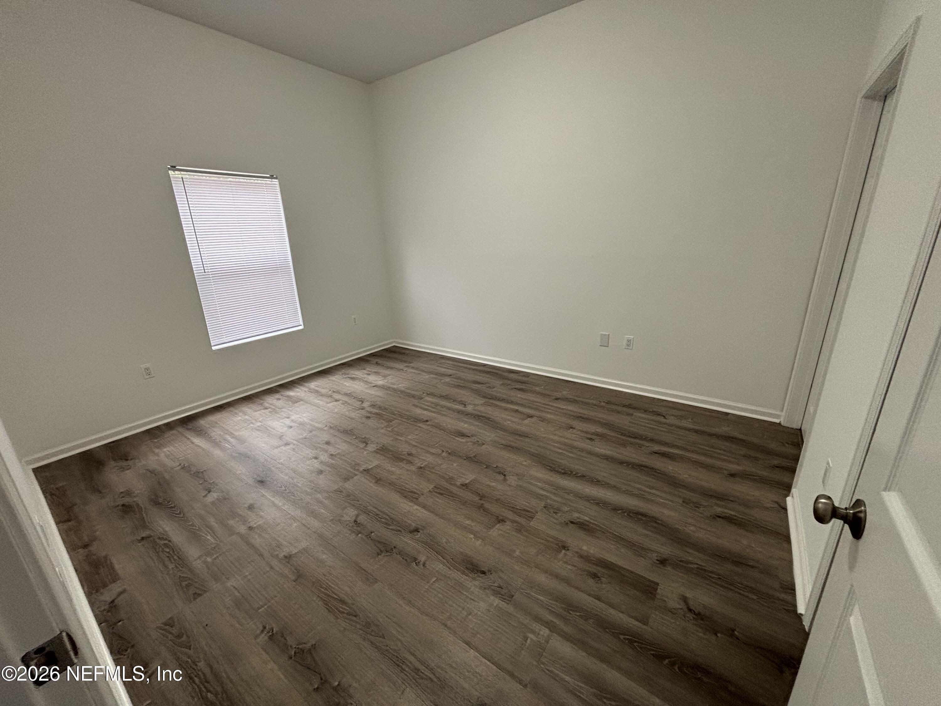9627 Belda Way, Unit 8 Jacksonville, FL 32257 - Photo 9 of 27 wooden floor in an empty room
