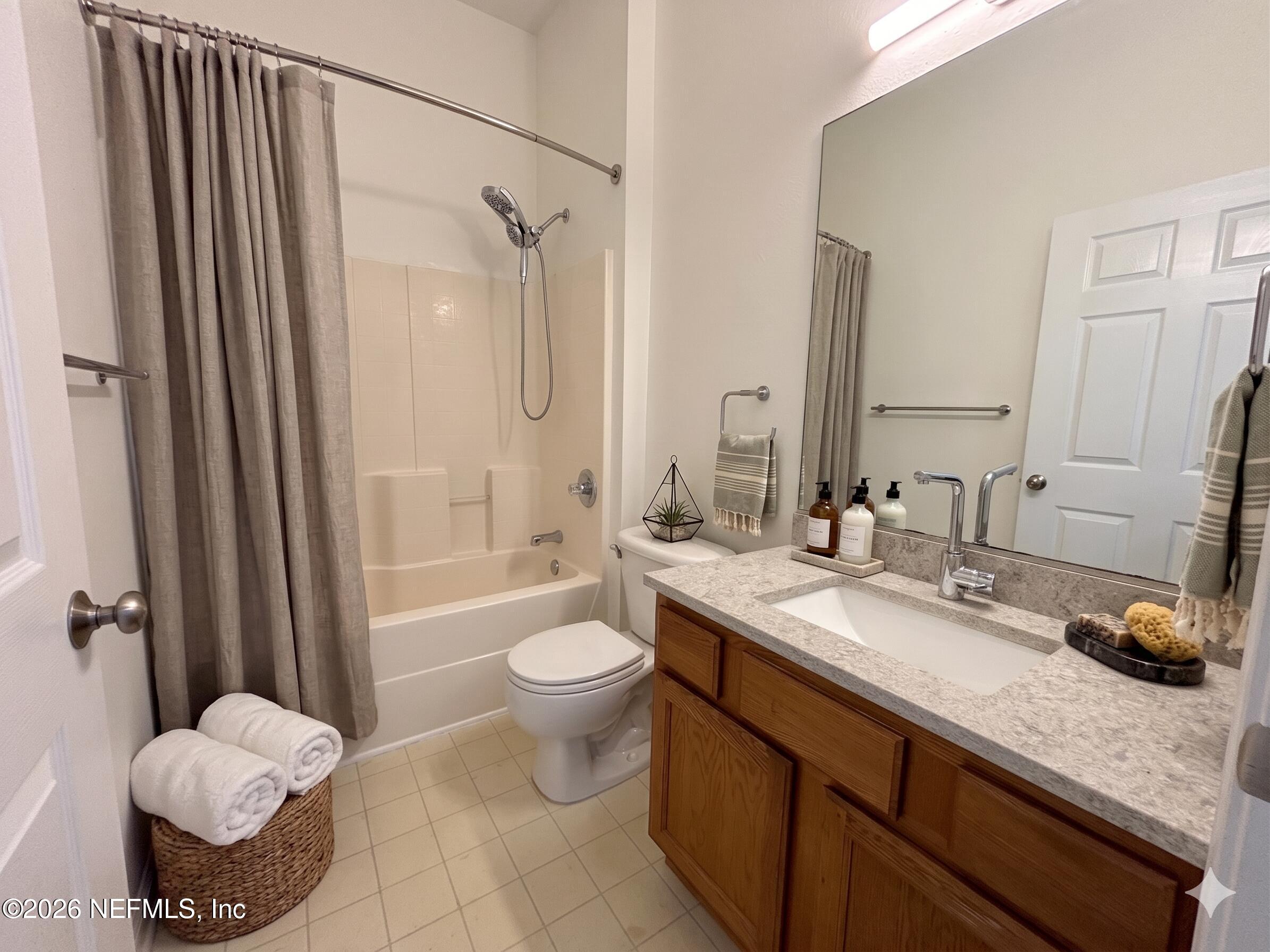 9627 Belda Way, Unit 8 Jacksonville, FL 32257 - Photo 10 of 27 a bathroom with a granite countertop sink toilet and shower