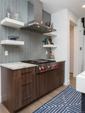 a kitchen with stainless steel appliances a sink and a stove