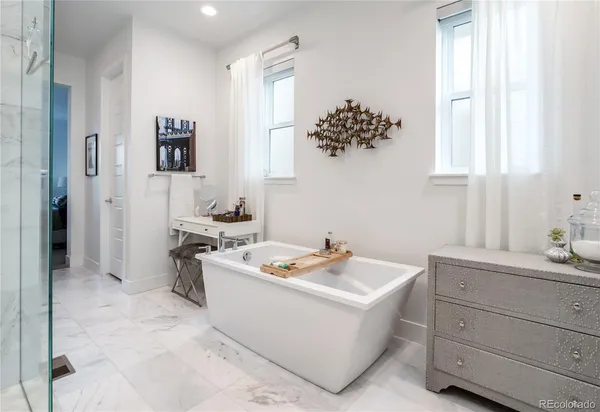 a room with a sink cabinets and a window