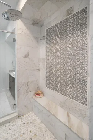 a bathroom with a bathtub and shower