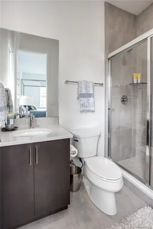 a bathroom with a sink toilet and shower