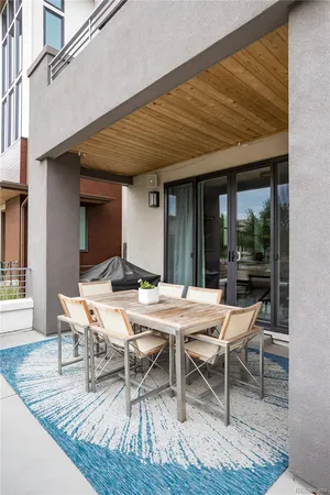 a outdoor space with a table and chairs