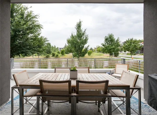 a view of a chairs and table on the deck