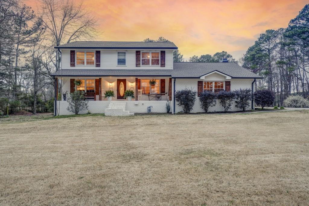 399 North Avery Road Northwest Rome, GA 30165 - Photo 1 of 1 a front view of a house with a yard