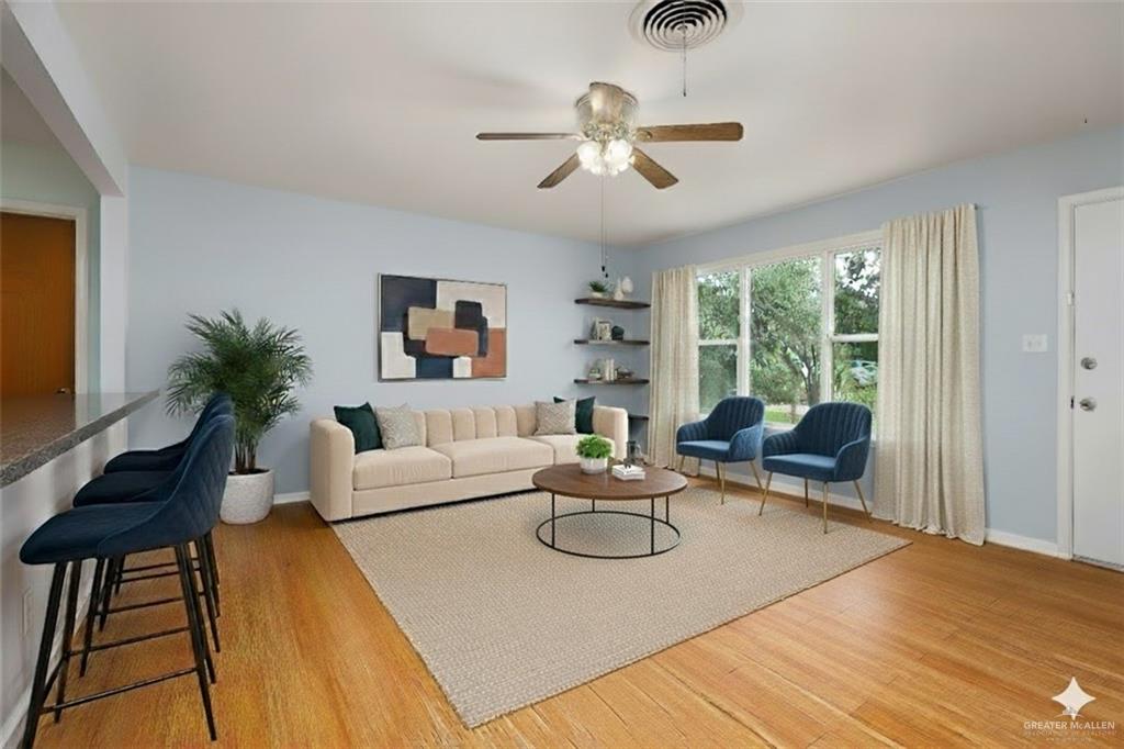 1001 West 7th Street Weslaco, TX 78596 - Photo 2 of 24 a living room with furniture and a large window