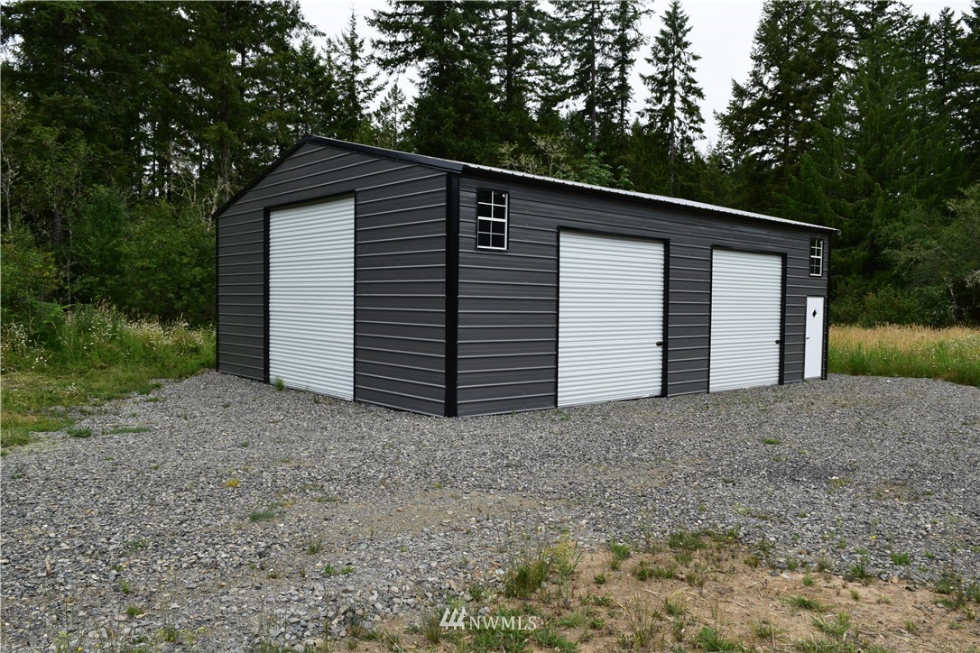 768 Logan Hill Road Chehalis, WA 98532 - Photo 8 of 35 a view of a house with a yard and garage