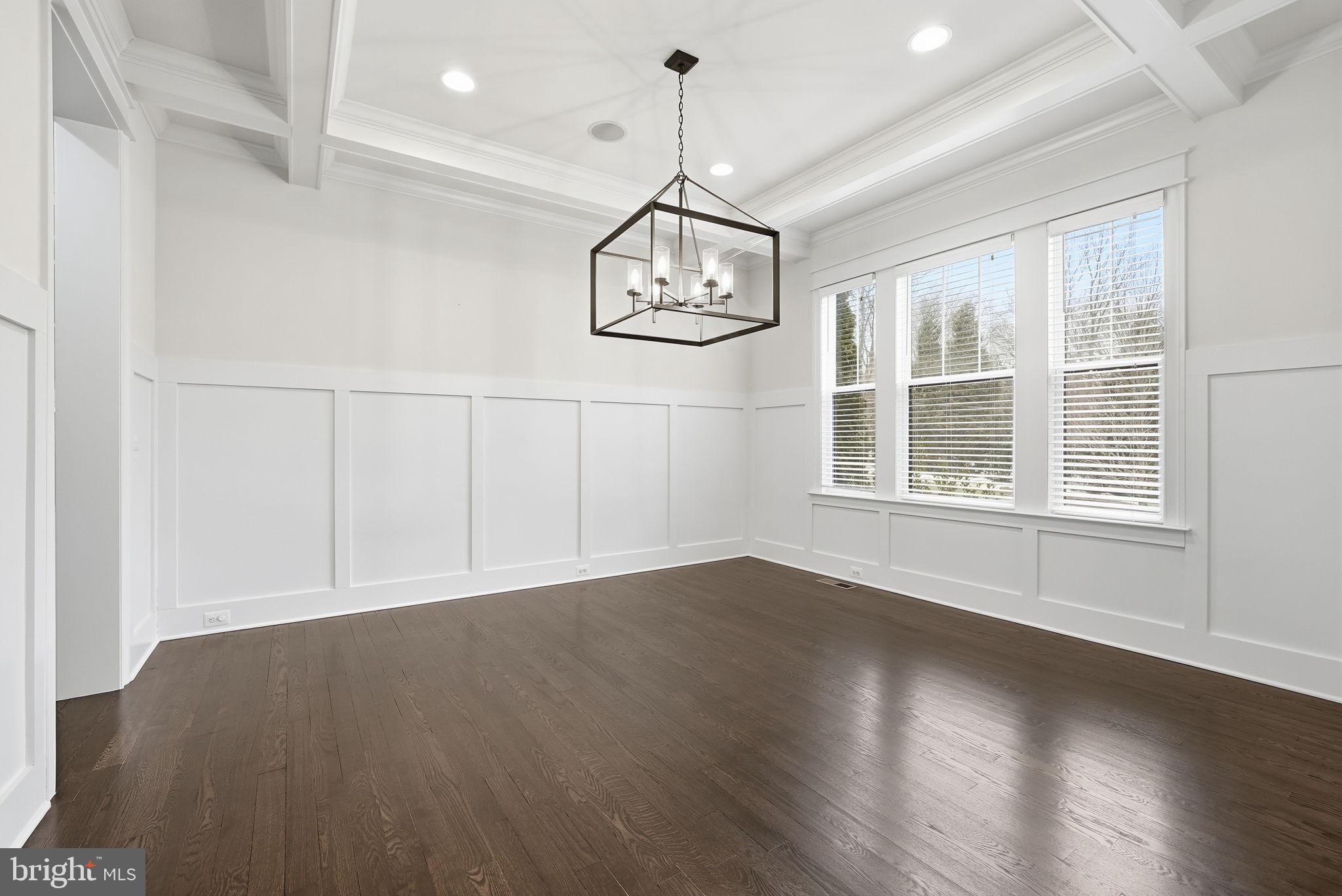2867 Hill Road Vienna, VA 22181 - Photo 28 of 70 an empty room with wooden floor cabinet and windows