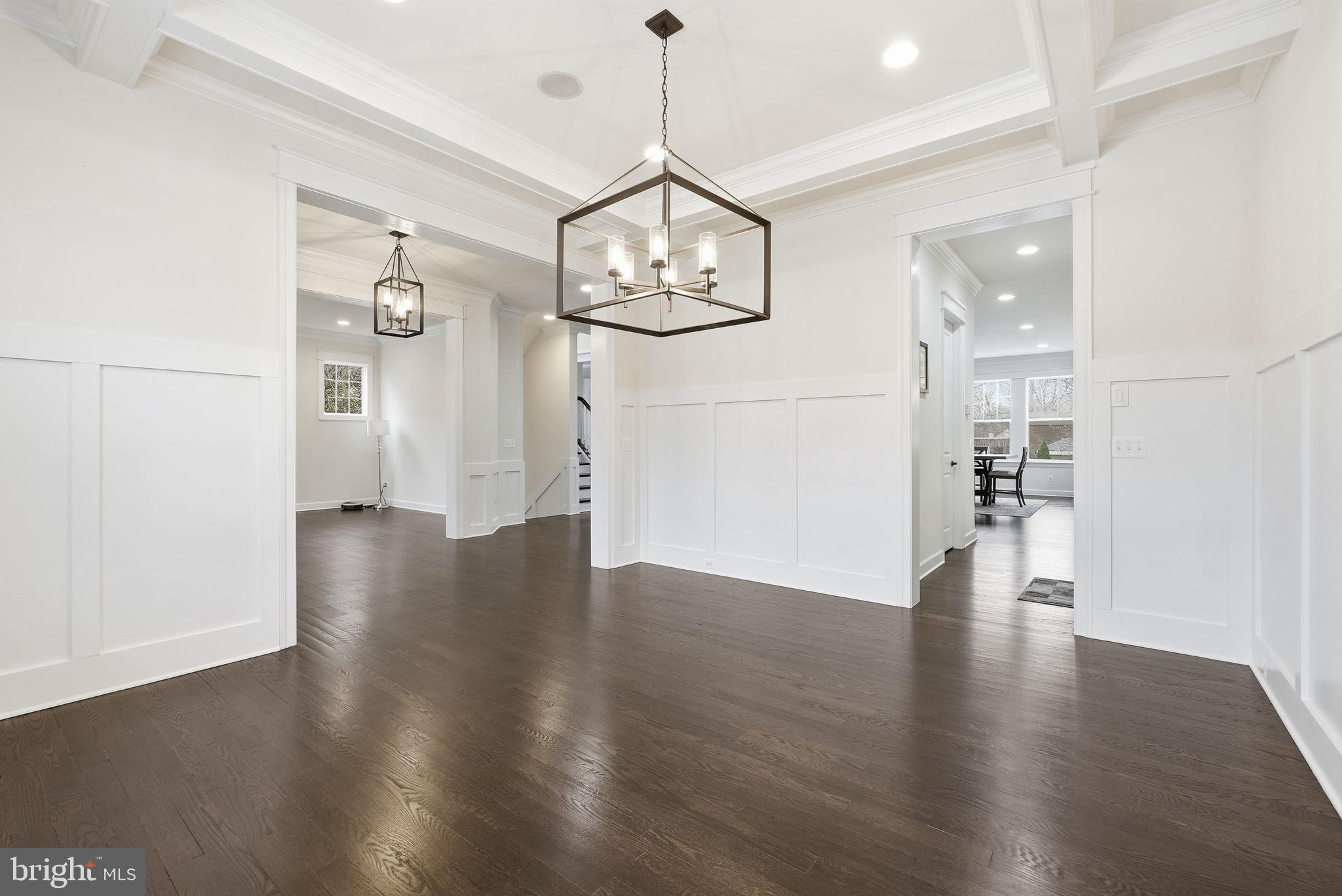 2867 Hill Road Vienna, VA 22181 - Photo 30 of 70 a view of a hallway with wooden floor and chandelier