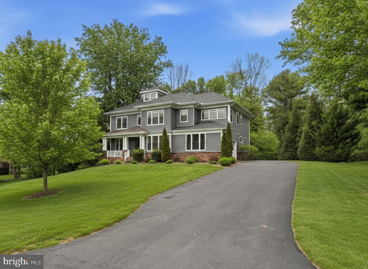 2867 Hill Road Vienna, VA 22181 - Photo 3 of 70 a view of a big house with a big yard and large trees