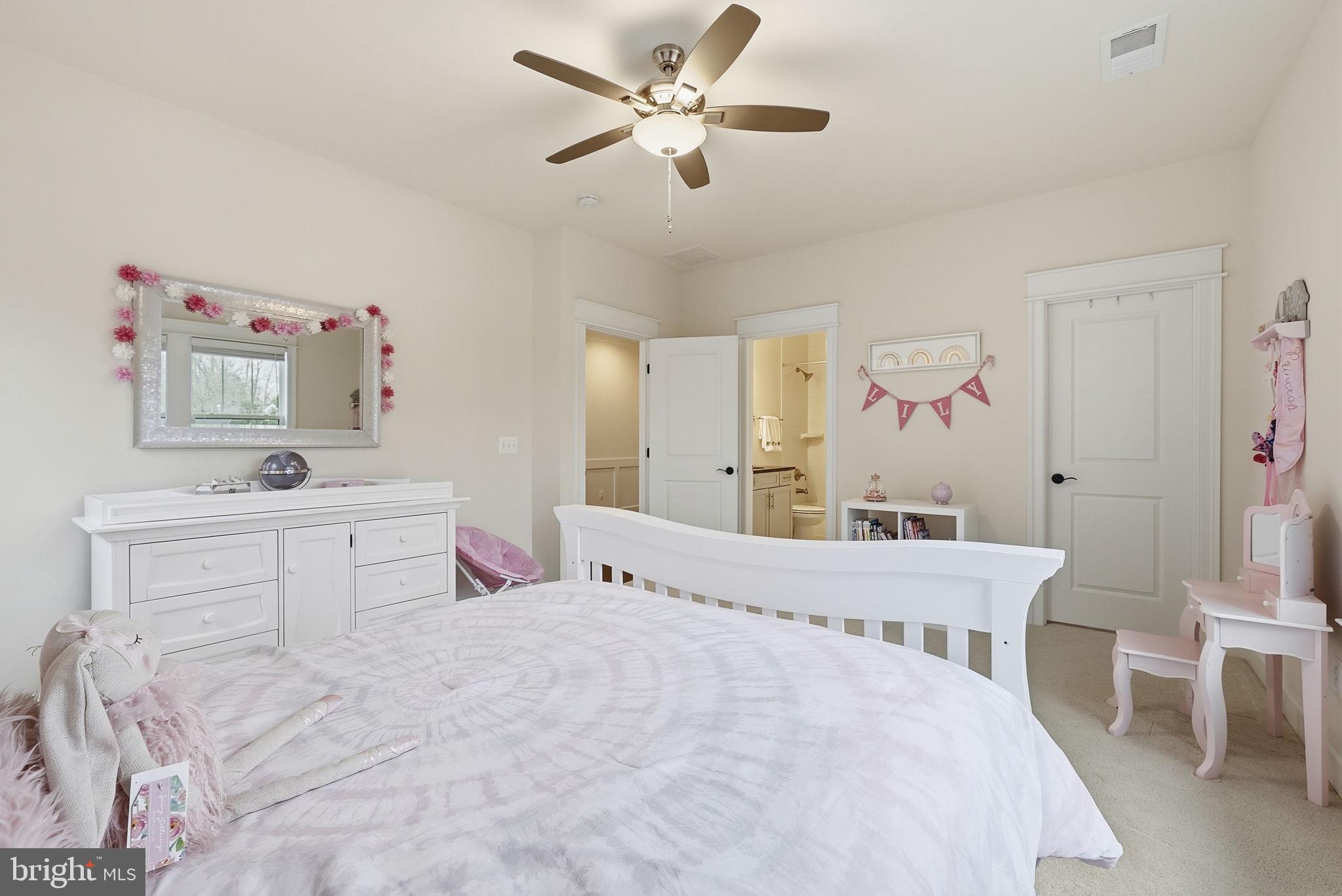 2867 Hill Road Vienna, VA 22181 - Photo 34 of 70 a bedroom with a bed and a chandelier