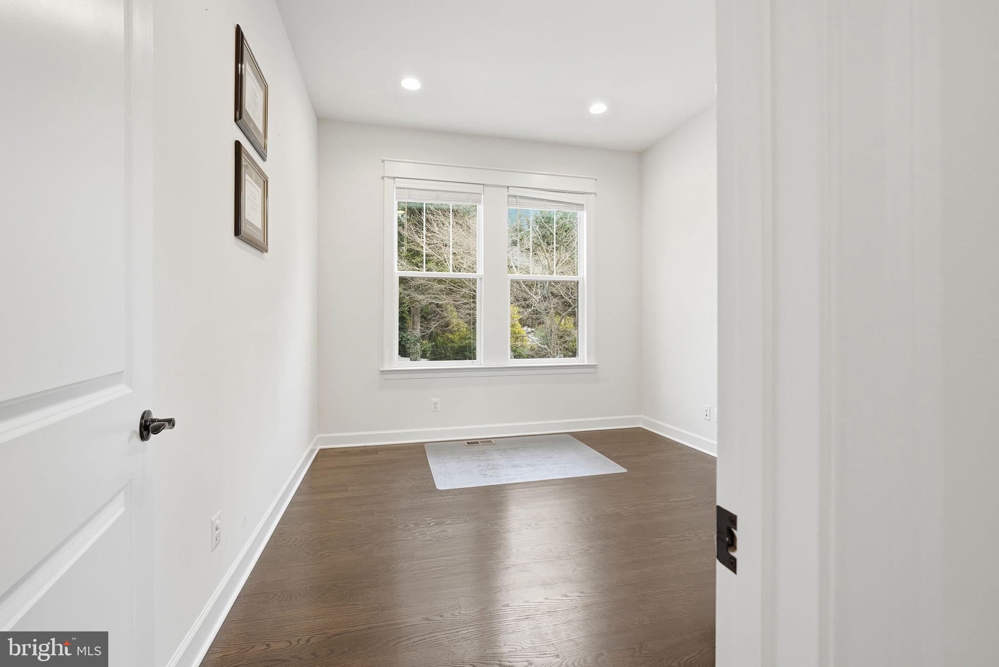 2867 Hill Road Vienna, VA 22181 - Photo 5 of 70 an empty room with wooden floor and windows