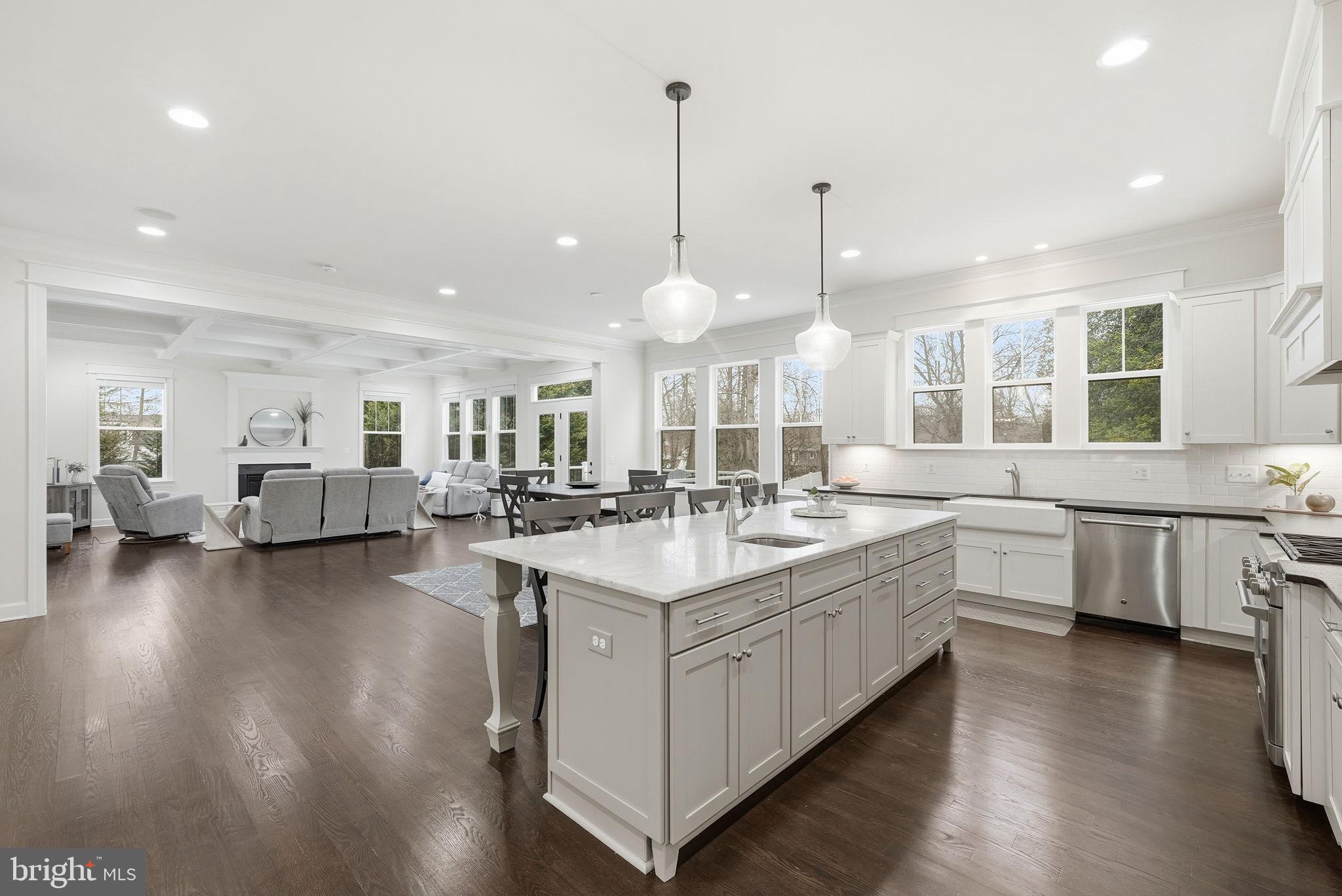 2867 Hill Road Vienna, VA 22181 - Photo 7 of 70 a large white kitchen with lots of counter space a sink and appliances