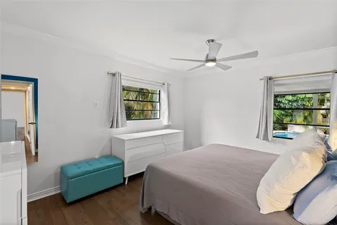 a bedroom with furniture and a window