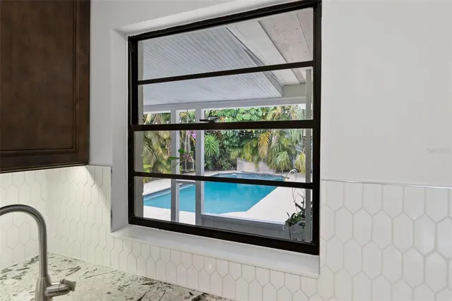 a view of a swimming pool and a patio