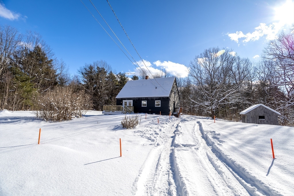 66 Minott Road Westminster, MA 01473 - Photo 34 of 41 a view of a house with a snow on the road