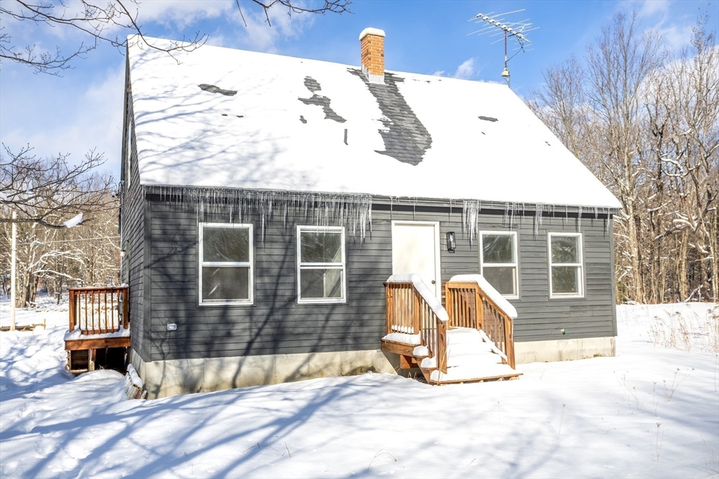 66 Minott Road Westminster, MA 01473 - Photo 38 of 41 a view of a house with a snow in the yard