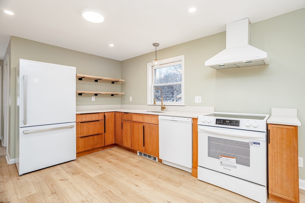66 Minott Road Westminster, MA 01473 - Photo 5 of 41 a kitchen with a refrigerator and a stove top oven
