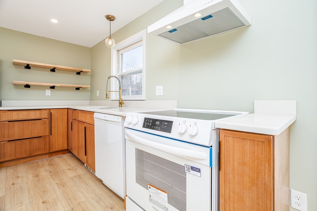 66 Minott Road Westminster, MA 01473 - Photo 8 of 41 a kitchen with a stove a sink and a refrigerator