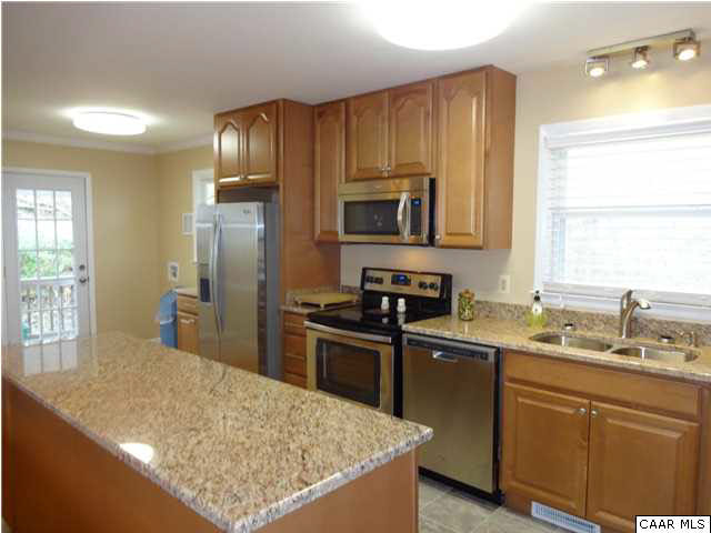 233 Hartmans Mill Road Charlottesville, VA 22902 - Photo 5 of 13 a kitchen with stainless steel appliances granite countertop a sink stove and refrigerator