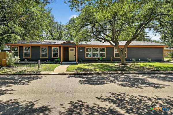 a view of a house with a garden