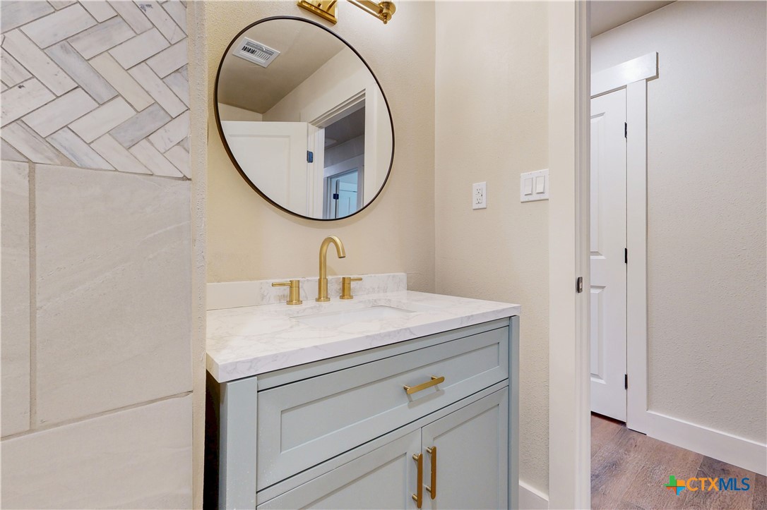 601 West Zenith Avenue Temple, TX 76501 - Photo 15 of 25 a bathroom with a sink and a mirror