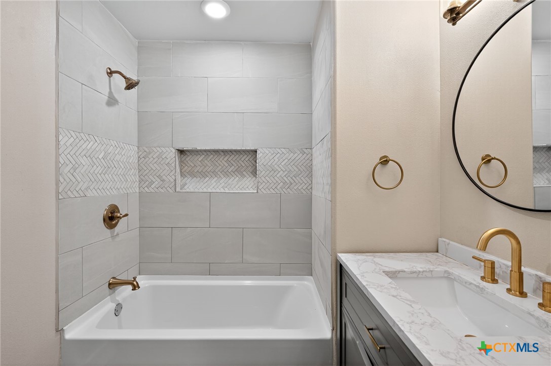 601 West Zenith Avenue Temple, TX 76501 - Photo 16 of 25 a bathroom with a sink a toilet and a bathtub