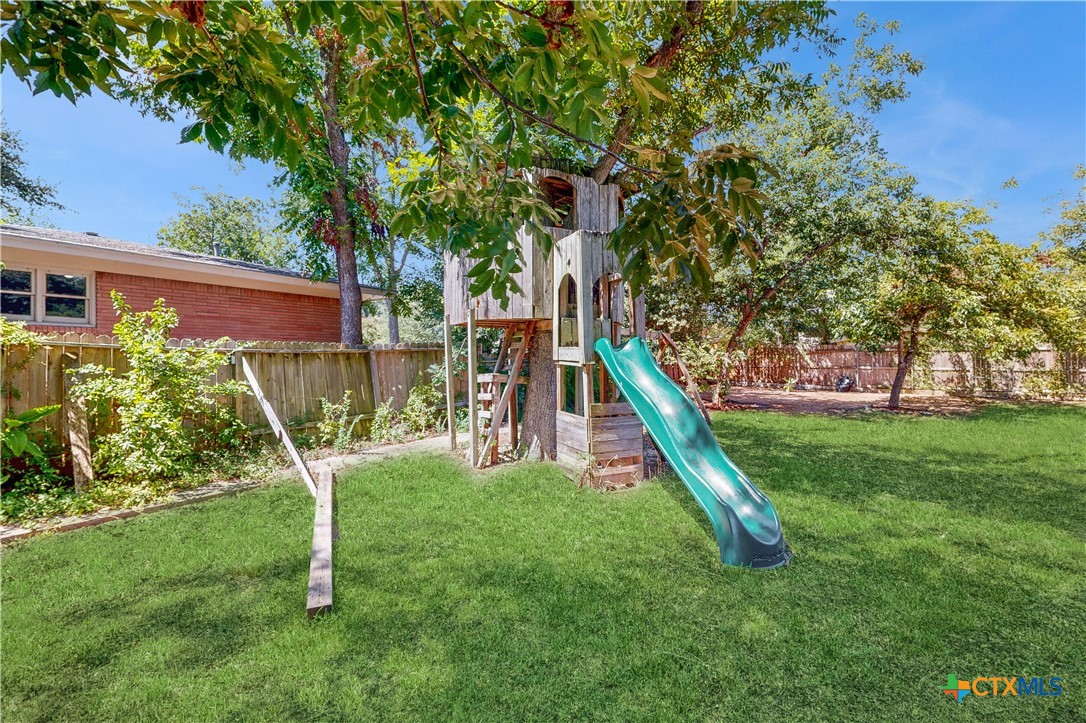 601 West Zenith Avenue Temple, TX 76501 - Photo 22 of 25 a view of a backyard with a slide