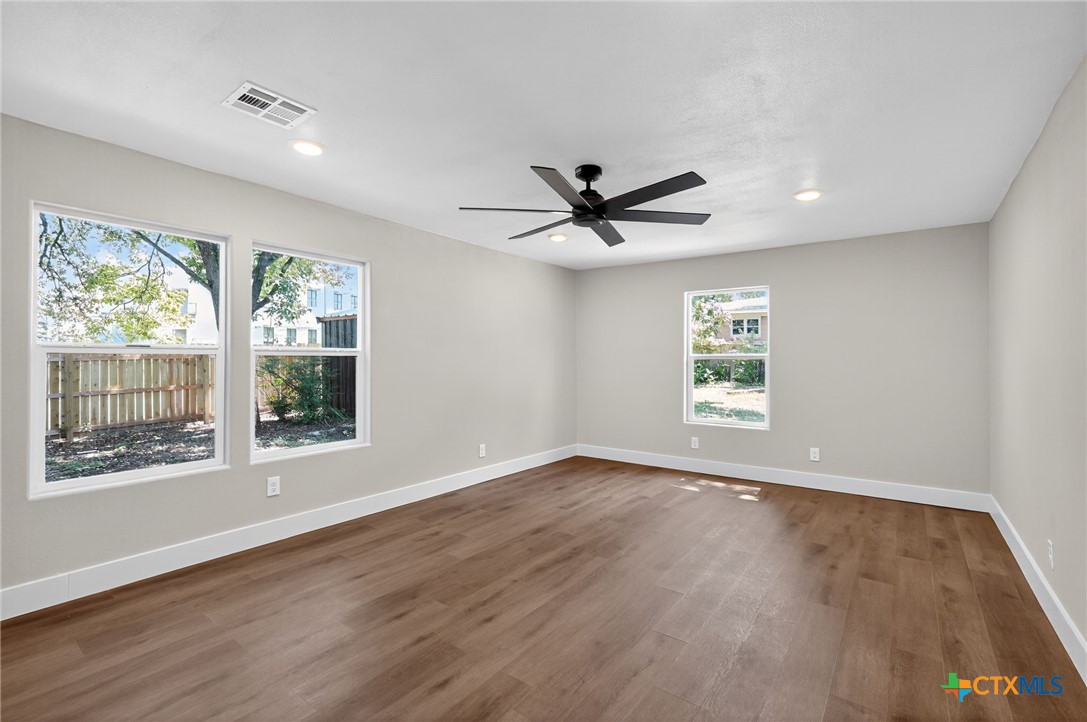 601 West Zenith Avenue Temple, TX 76501 - Photo 9 of 25 a view of a big room with wooden floor and windows