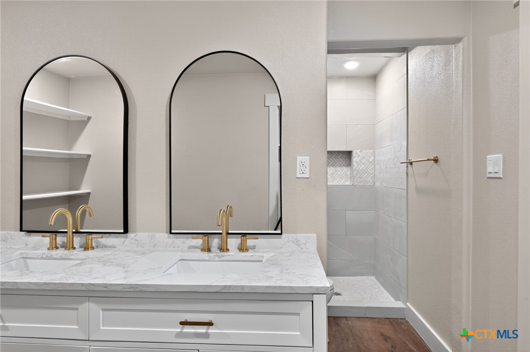 601 West Zenith Avenue Temple, TX 76501 - Photo 10 of 25 a bathroom with a sink and a mirror
