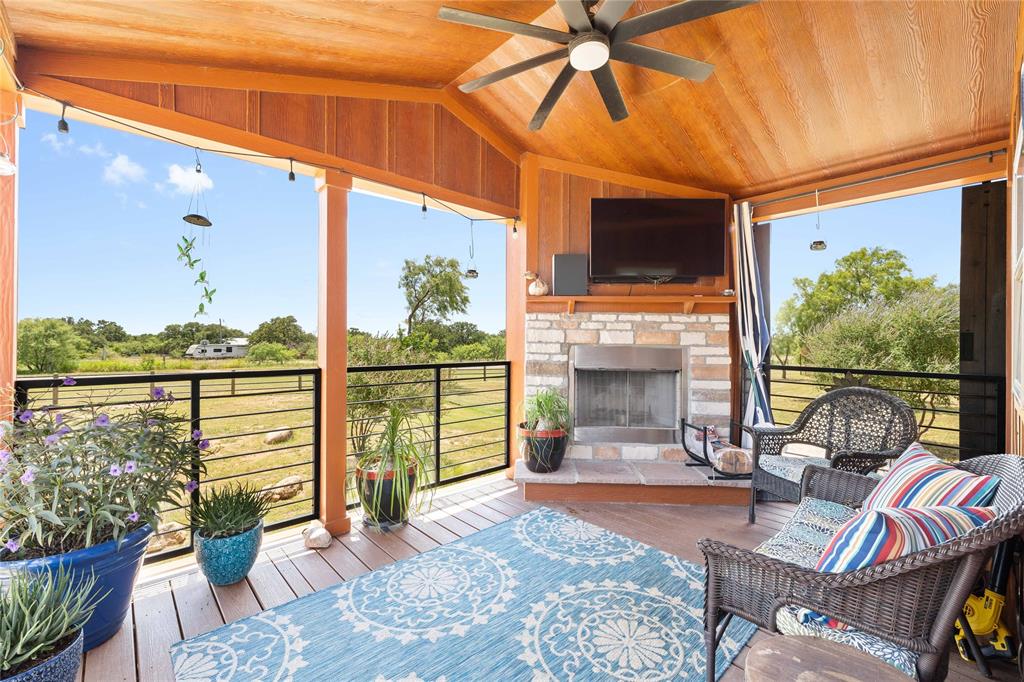 1010 Fm 583 Street West Rising Star, TX 76471 - Photo 34 of 40 a living room with patio furniture and a fireplace